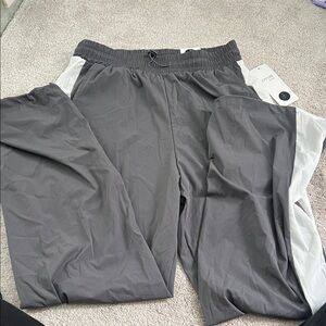 Gray and white active pants. Brand new with tags. Size L